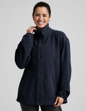 blue fleece button up jacket with a full front zip and snap closures and pockets.