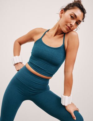 blue racerback cropped tank top with slim straps.