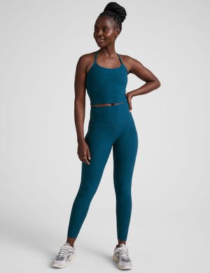 blue racerback cropped tank top with slim straps.