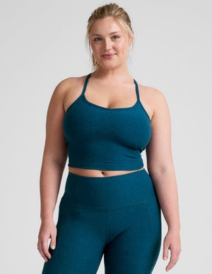 blue racerback cropped tank top with slim straps.