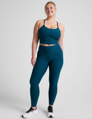 blue racerback cropped tank top with slim straps.