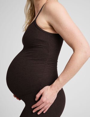 brown maternity midi length tank jumpsuit with adjustable straps.